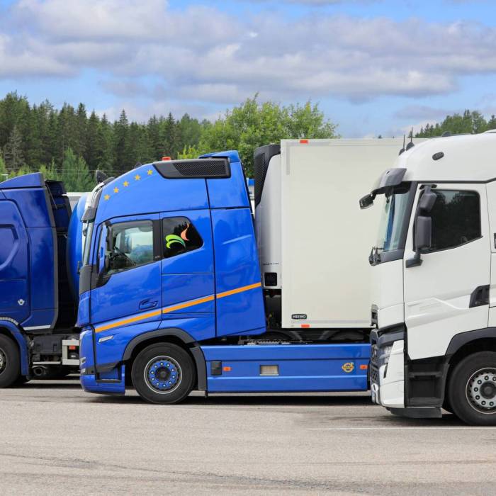 New Scania R580, Volvo FH and Renault heavy trucks parked on a truck stop yard on a day of summer, side view. Salo, Finland. July 14, 2024.